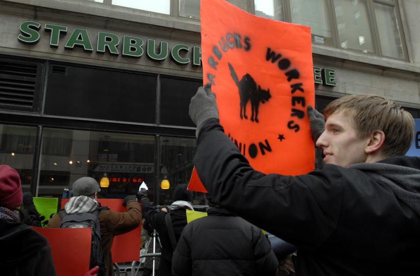 Starbucks workers and their supporters protest outside a New York City store
