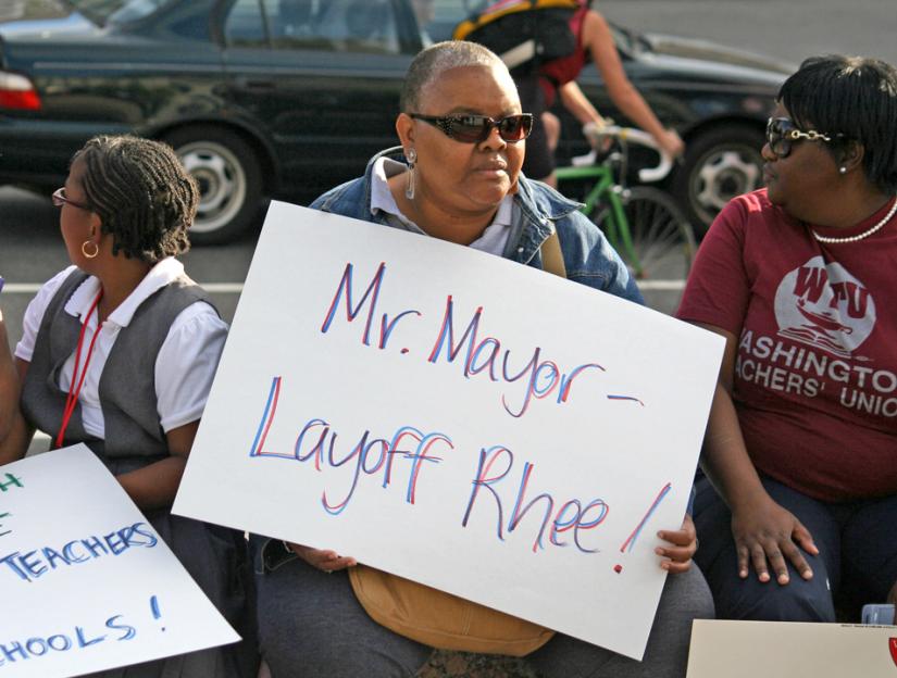Teachers and their supporters rallied against Michelle Rhee's announcement of hundreds of layoffs