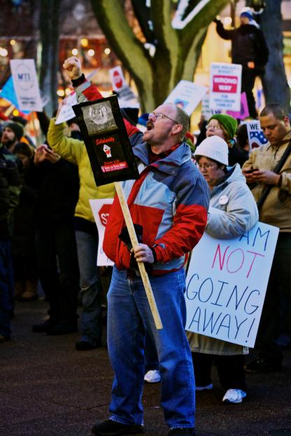 Crowds of people gathered in furious protest as lawmakers rammed through Scott Walker's union-busting assault