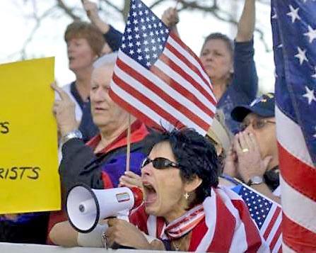 Anti-Muslim bigots harass attendees of a charity fundraiser at a community center in Yorba Linda, Calif.