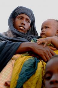 A young woman and her two young children in a refugee settlement in Bossaso, Puntland, Somalia