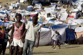 Thousands of people displaced by the earthquake are taking up shelter in a camp of makeshift tents