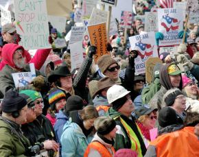 Workers and families from all over Wisconsin join in protest outside the Capitol in Madison