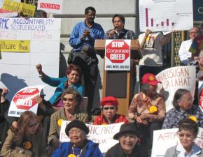 A community activist demands that Sutter Health be held accountable at a City Hall rally in San Francisco