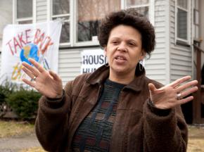 Catherine Lennon in front of her home