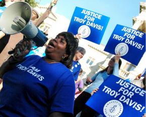 Protesters on the steps of the capitol building in Atlanta demand justice for Troy Davis