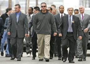 NOPD officers walk out of court with the their lawyers after being indicted for murder