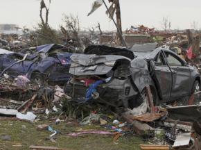 Wrecked cars and debris in Moore, Okla., after the tornado struck
