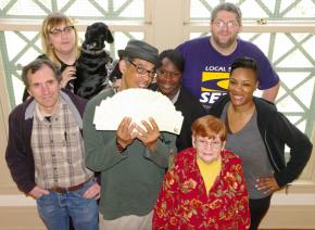 Workers celebrate after turning in hundreds of union cards