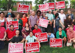 Ty Moore (center with pink shirt) surrouned by supporters of his socialist campaign for City Council in Minneapolis