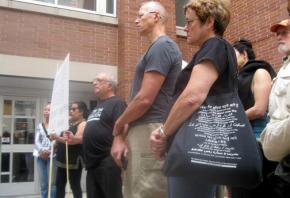 Event organizers address a press conference outside Evanston Public Library about reinstating Ali Abunimah's book talk